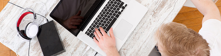 guy at desk with laptop