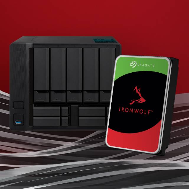 A multi-bay NAS system with a Seagate IronWolf NAS hard drive standing next to it