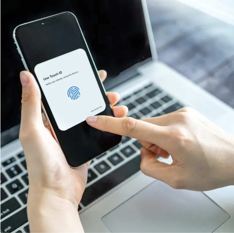 Person using Touch ID on smartphone with verification prompt