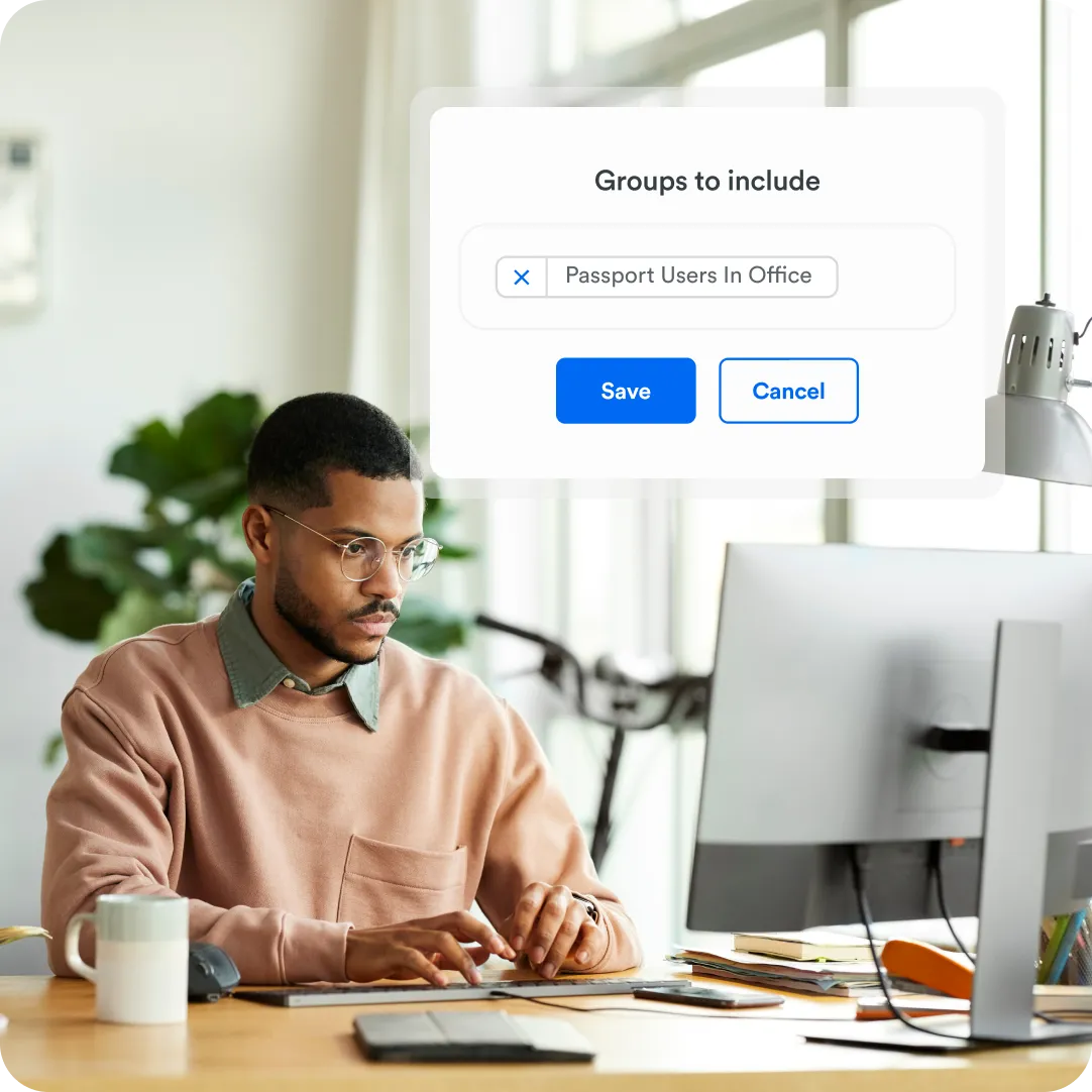Professional sitting at desk giving permission security access to their team with Duo Passport