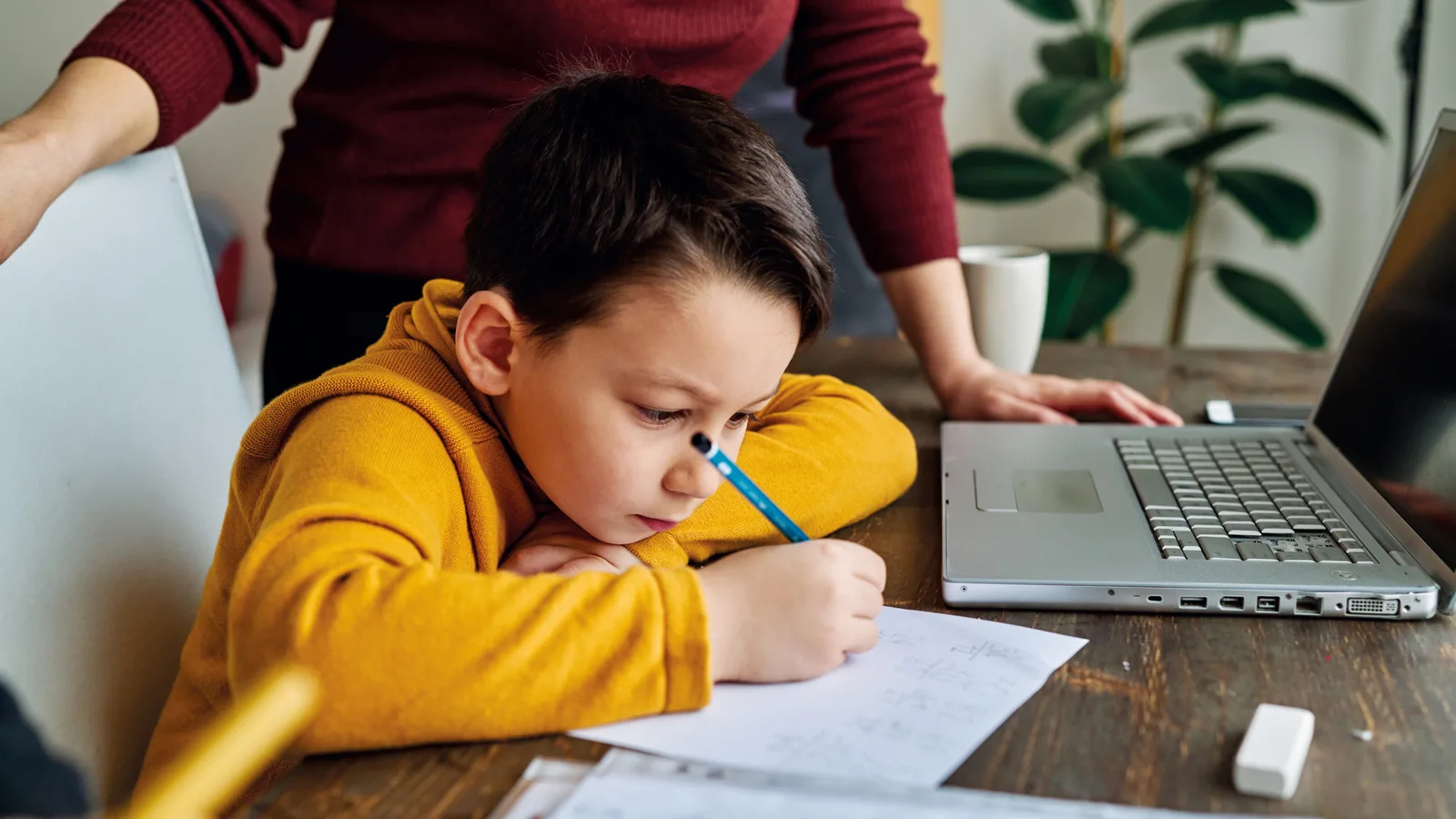 Education at home. Child learning mathematics with family.