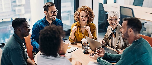 Group of people sitting and discussing something