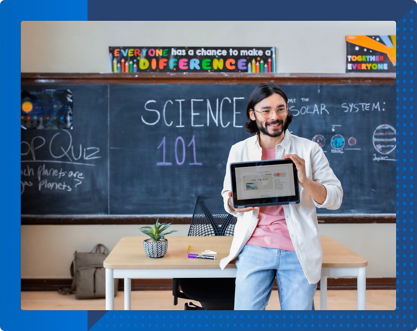 Teacher and student smiling while using a laptop