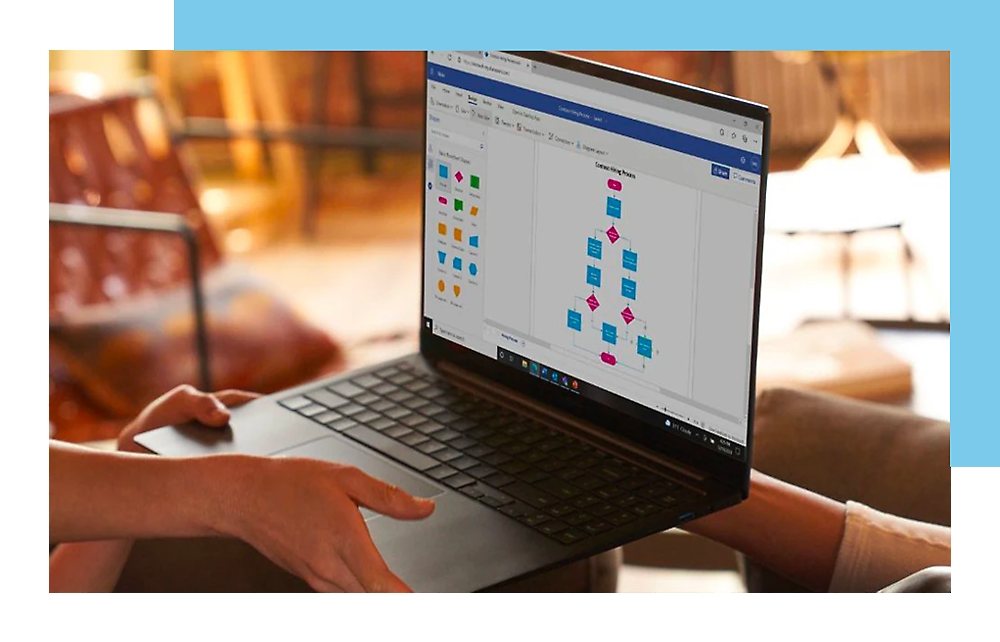 A person holding laptop in hands