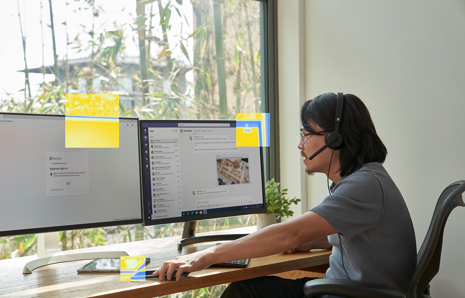 Person using a desktop computer with dual monitors and a headset.