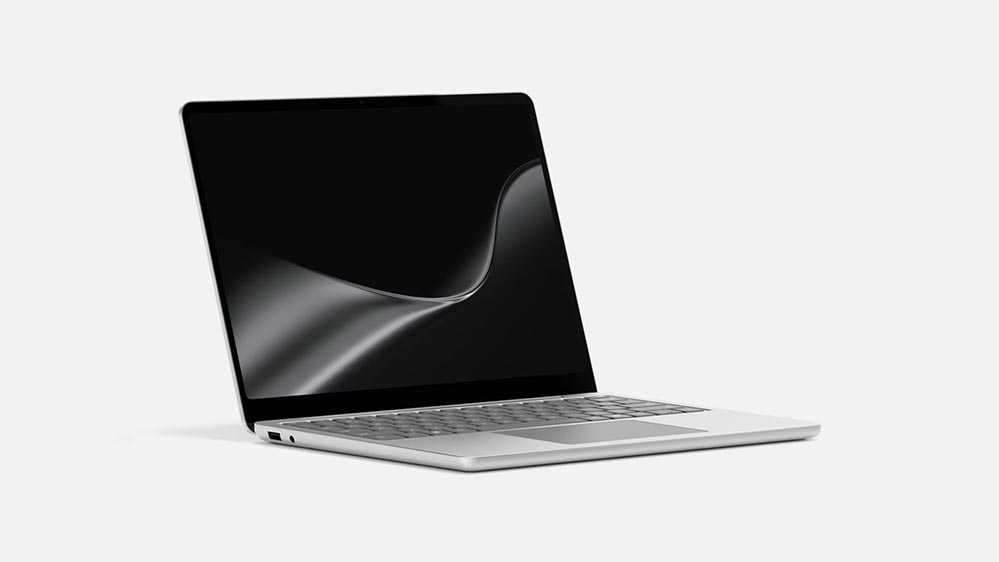 Two Surface Laptop for Business devices side by side, one platinum and one black, shown open at an angle.