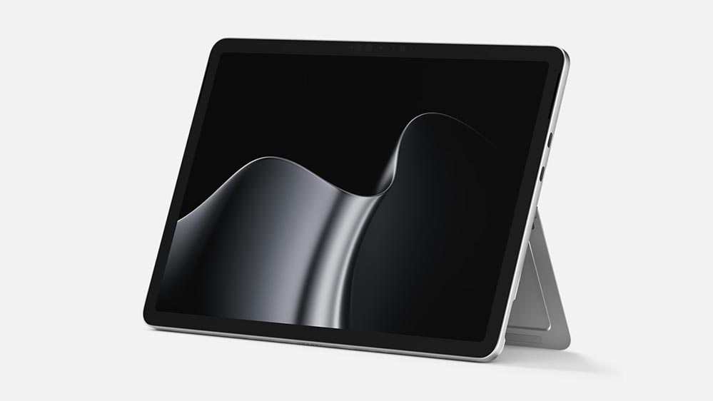 A platinum Surface Pro for Business shown with its keyboard attached.